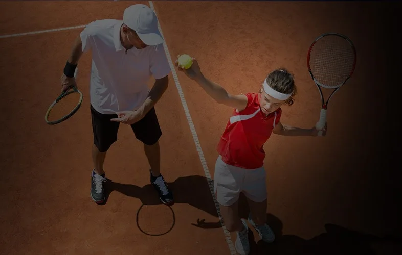 A junior tennis lesson on court